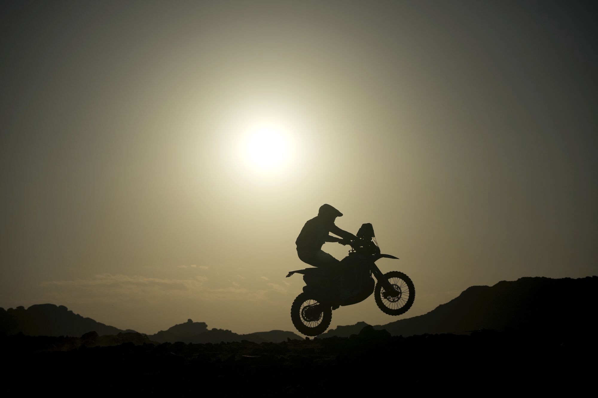A rider jumps during the sixth stage of the Dakar Rally between Hail and Al Duwadimi, Saudi Arabia, Saturday, Jan. 11, 2025. (AP Photo/Christophe Ena) Associated Press/LaPresse. EDITORIAL USE ONLY/ONLY ITALY AND SPAIN