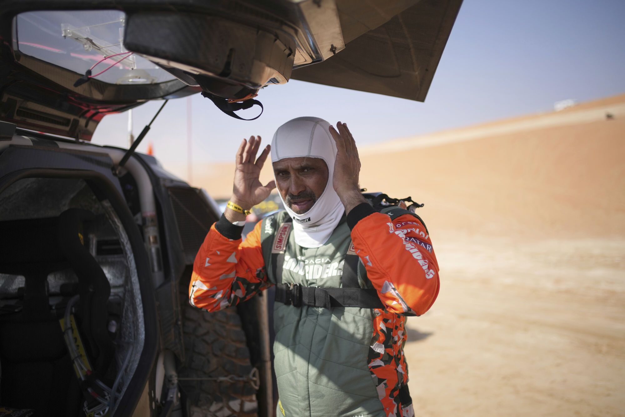 Driver Nasser Al-Attiya prepares at the start delayed due to fog during the eleventh stage of the Dakar Rally with start and finish in Shubaytah, Saudi Arabia, Thursday, Jan. 16, 2025. (AP Photo/Christophe Ena)