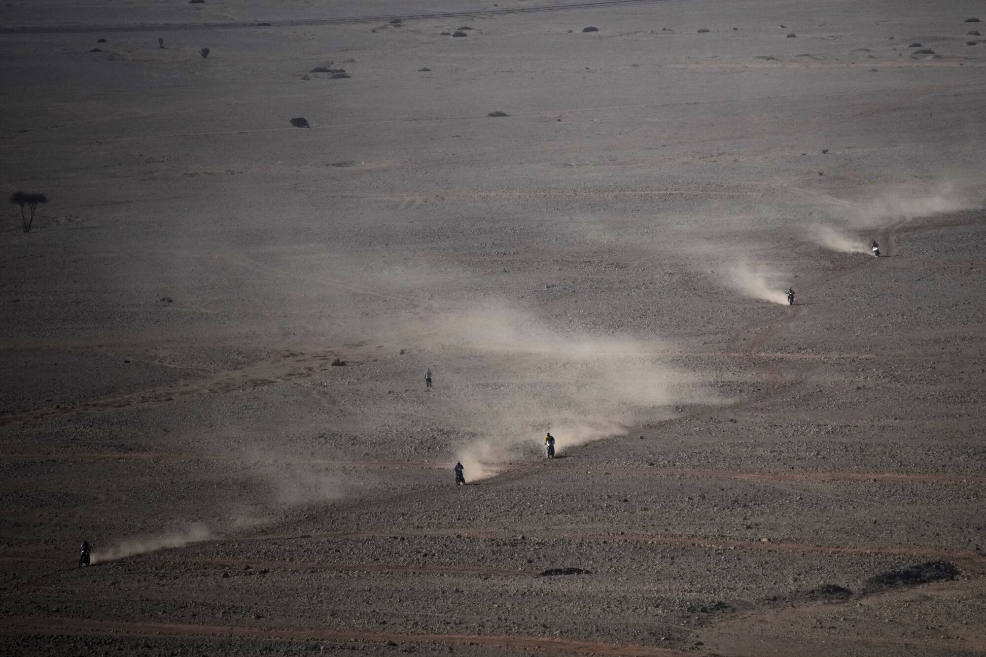 Riders compete during the ninth stage of the Dakar Rally between Riyadh and Haradh, Saudi Arabia, Tuesday, Jan. 14, 2025. (AP Photo/Christophe Ena)