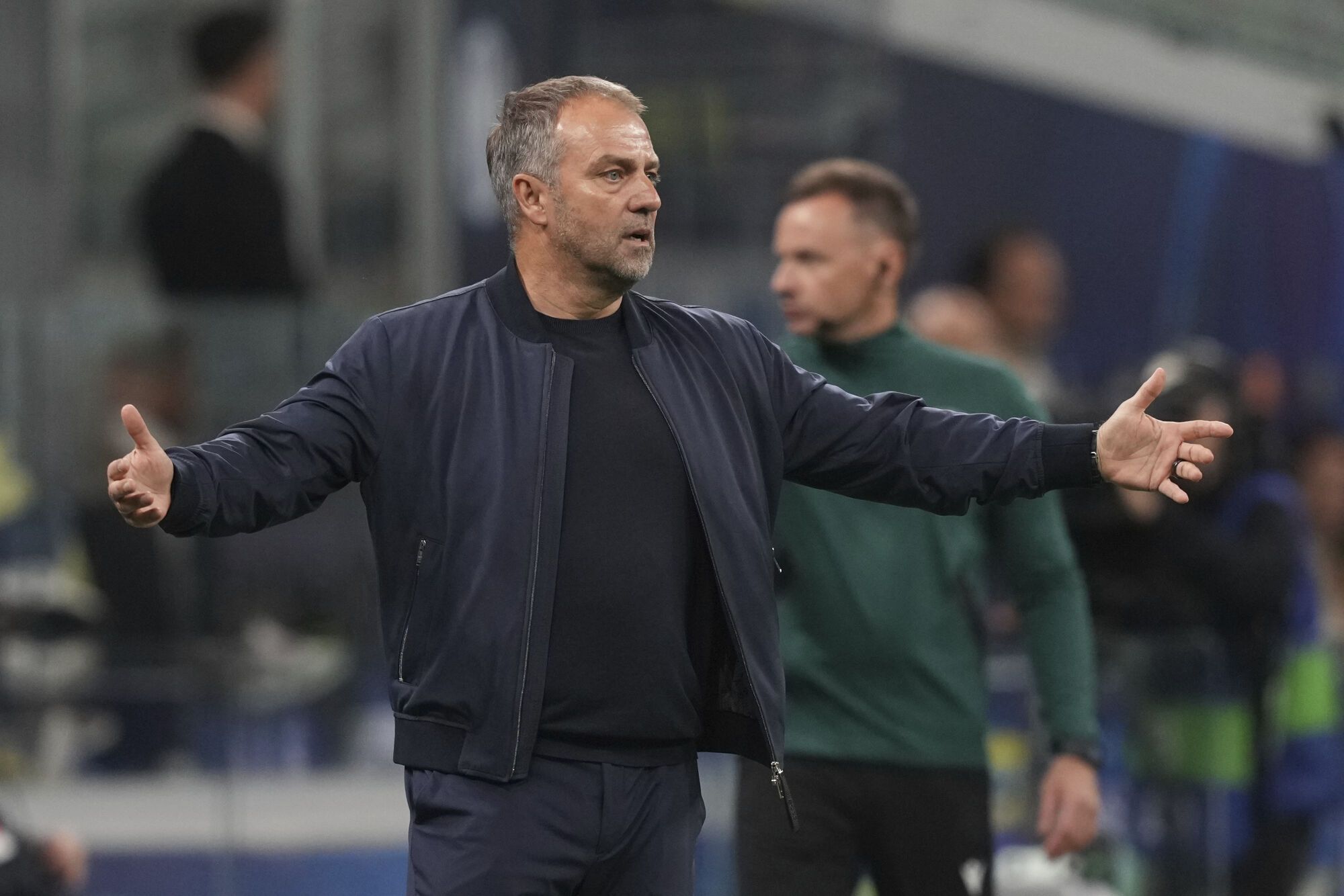 Barcelona's head coach Hansi Flick reacts during the Champions League semifinal second leg soccer match between Inter Milan and Barcelona at San Siro stadium in Milan , Italy, Tuesday, May 6, 2025. (AP Photo/Antonio Calanni)